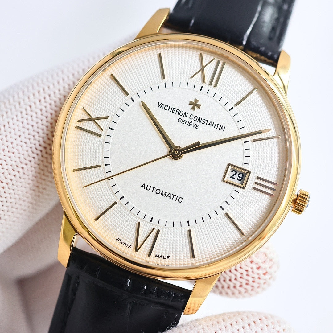Automatic wristwatch with white dial, Roman numerals, date window, gold case, black leather strap