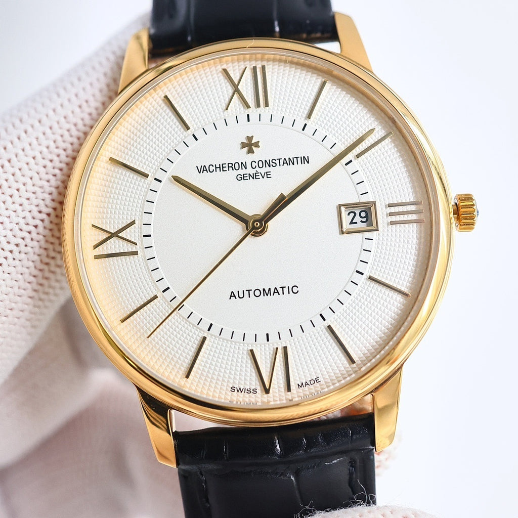 Automatic wristwatch with white textured dial, Roman numerals, date window, gold case, black strap