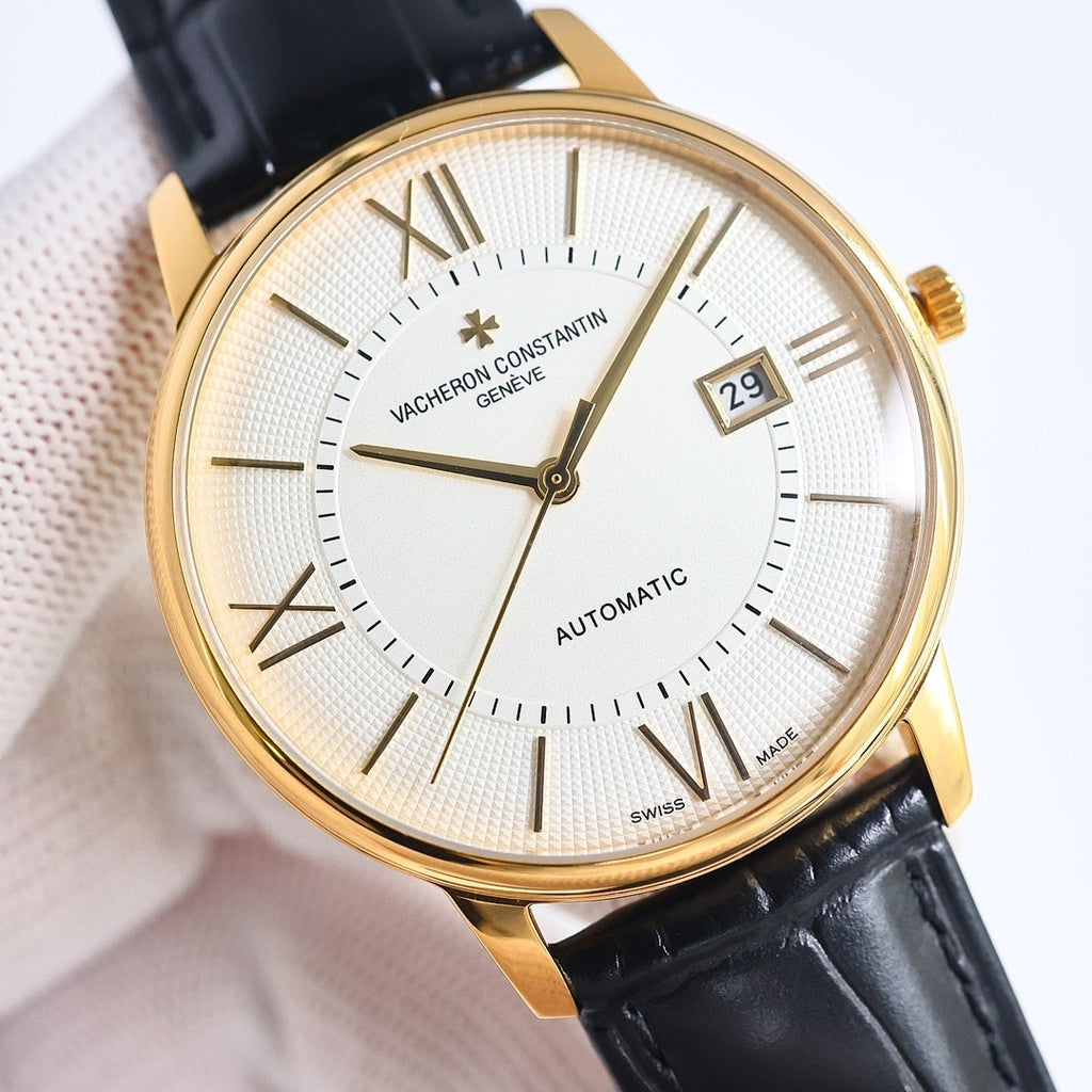 Automatic wristwatch with white dial, Roman numerals, date window, gold case, black leather strap