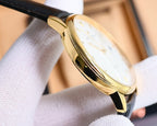 Automatic wristwatch side view with gold-tone case, black leather strap, white dial