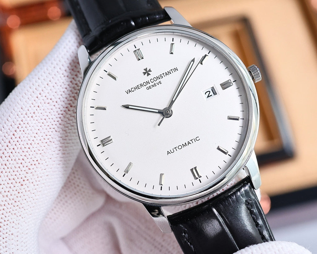 Automatic wristwatch with silver-tone case, white dial, black leather strap, date 21