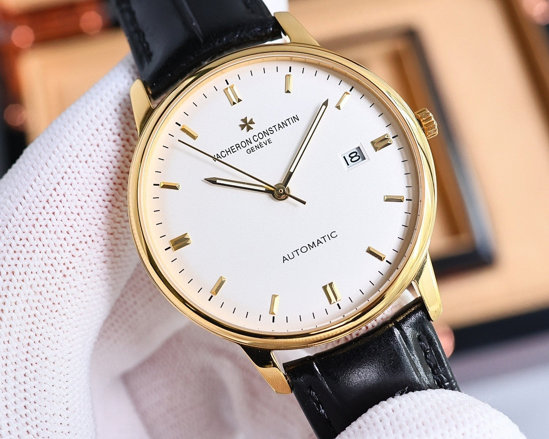 Automatic wristwatch with gold-tone case, white dial, black leather strap, date 18