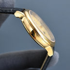 Vacheron Constantin wristwatch with gold side profile and black leather strap.