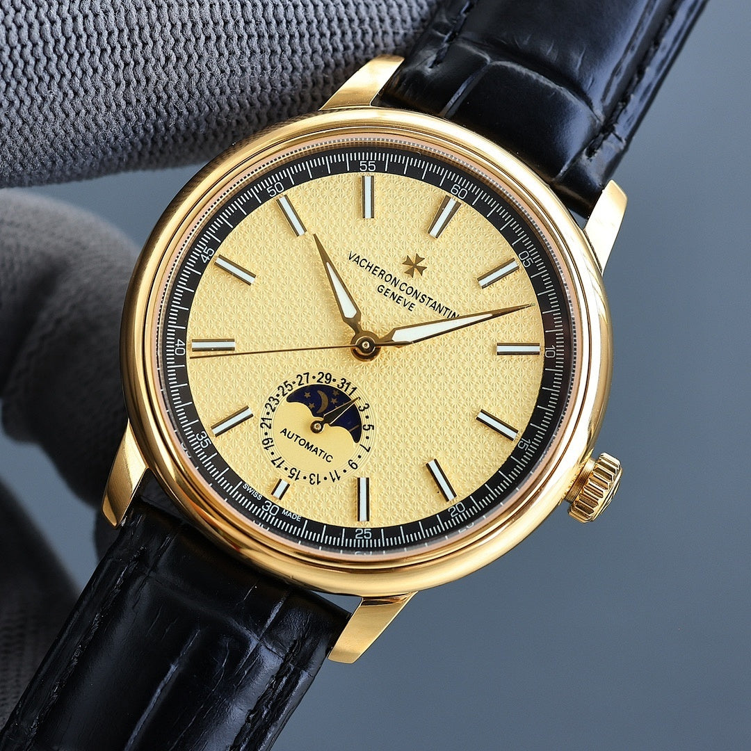 Vacheron Constantin watch with gold case, black leather strap, yellow dial and subdial.