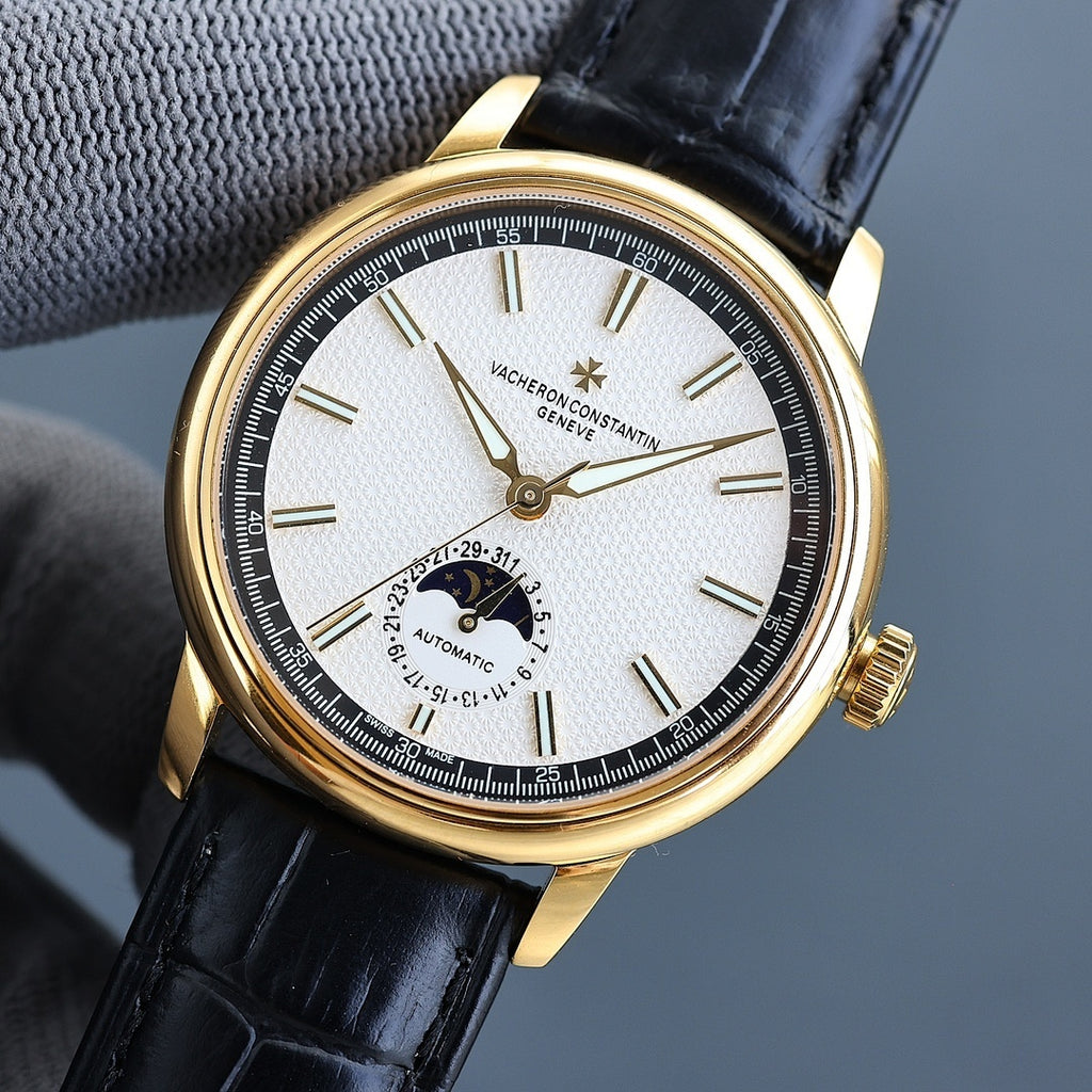 Vacheron Constantin watch with gold case, black leather strap, white dial with subdial.