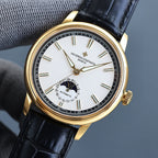 Vacheron Constantin watch with gold case, black leather strap, white dial with subdial.