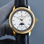 Vacheron Constantin watch with gold case, black leather strap, white dial and hour markers.