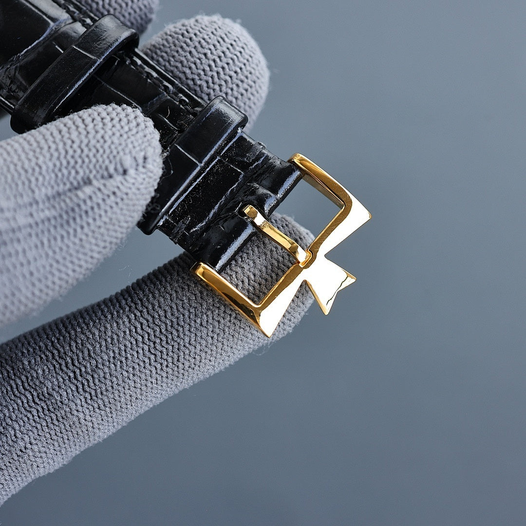 Vacheron Constantin watch buckle and black leather strap with gold clasp and loop.