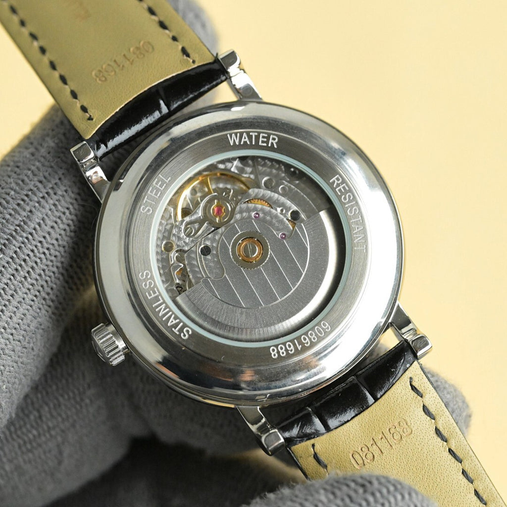 Vacheron Constantin watch caseback with visible movement, WATER and RESISTANT labels