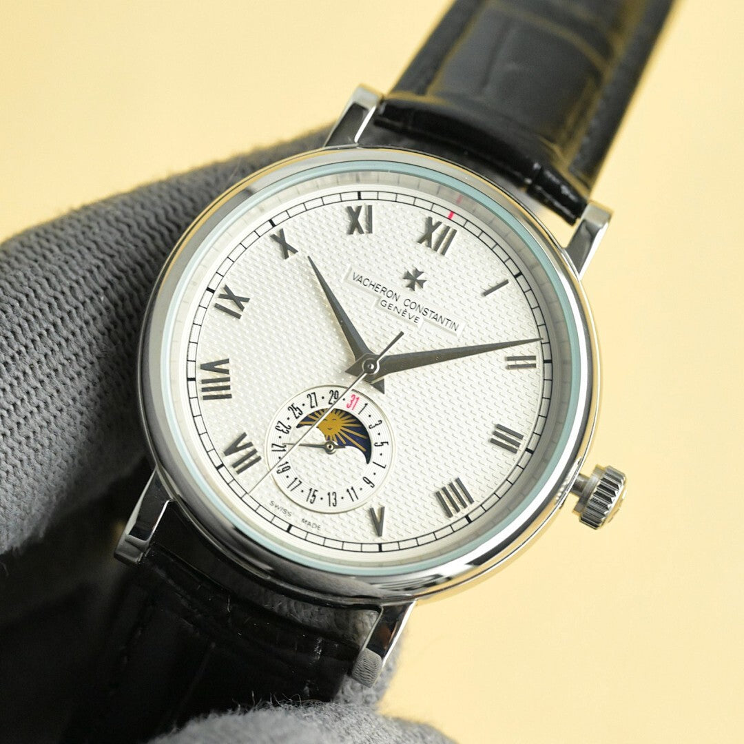 Vacheron Constantin watch with white dial, Roman numerals, black leather strap, subdial at 6