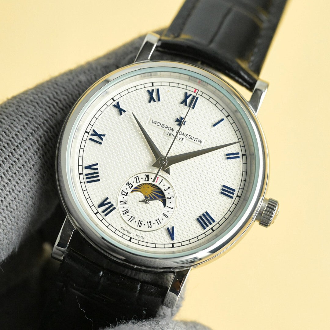 Vacheron Constantin watch with white dial, Roman numerals, black leather strap, side crown