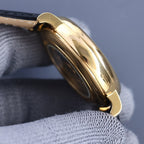 Vacheron Constantin watch side profile with gold-tone case and dark leather strap