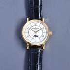 Vacheron Constantin watch with white dial, blue-toned strap, gold-tone case