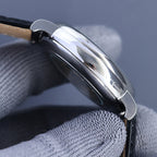 Vacheron Constantin wristwatch side profile with polished steel case and black leather strap