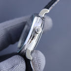 Vacheron Constantin watch side with crown detail and polished steel case on black leather