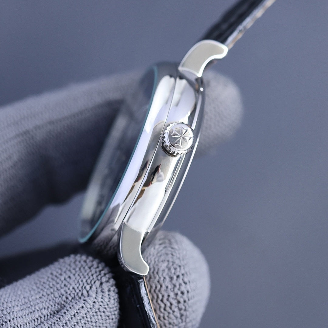 Vacheron Constantin watch side with crown detail and polished steel case on black leather