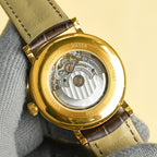 Vacheron Constantin watch caseback with visible mechanical movement and gold rim.