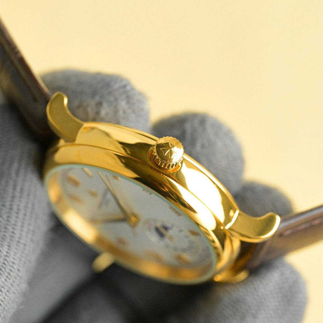 Vacheron Constantin watch side profile with gold crown and leather strap.