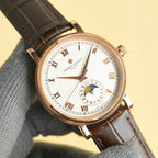 Vacheron Constantin watch front angle with white dial, gold indices, brown leather strap.