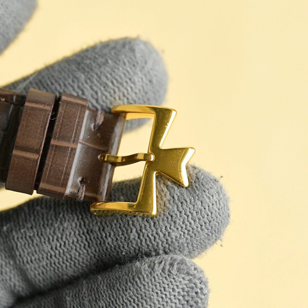 Vacheron Constantin watch clasp view with gold buckle and brown leather strap.