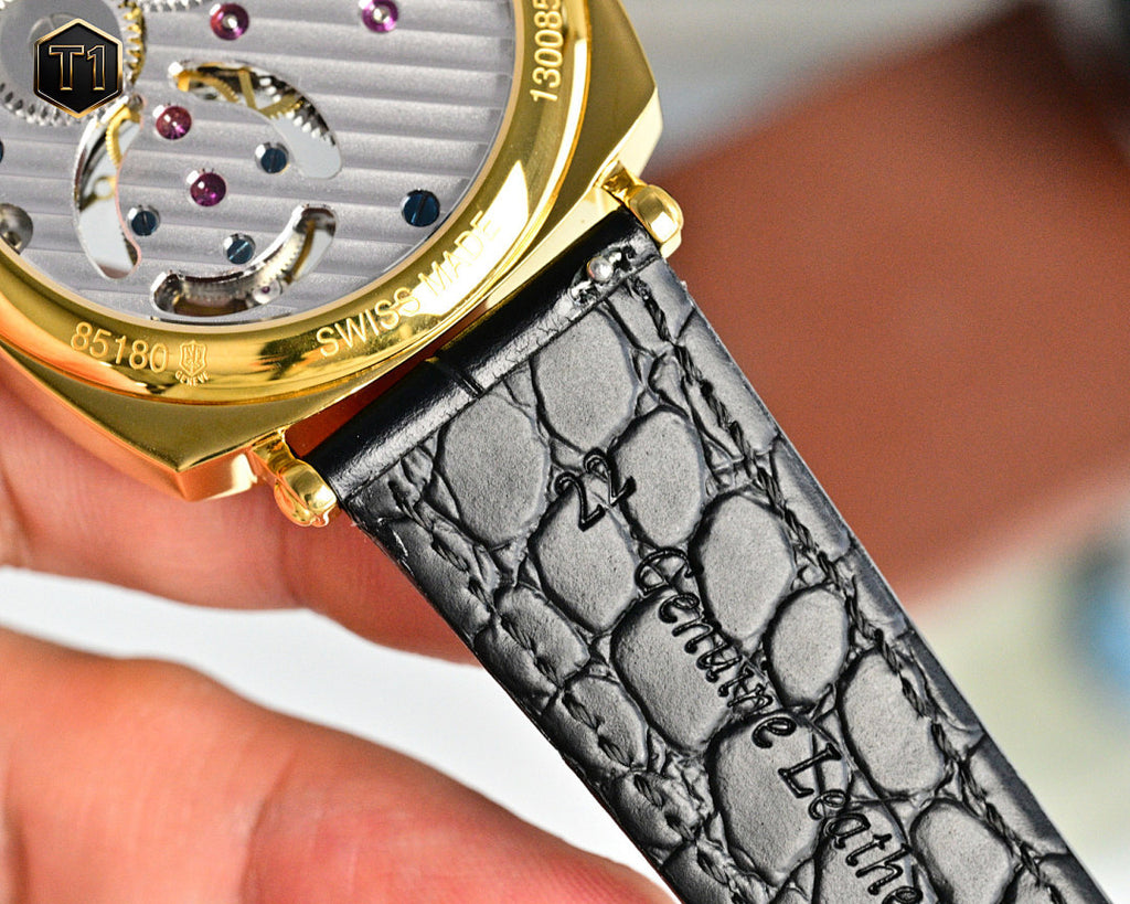 Vacheron Constantin watch with black leather strap and gold caseback details