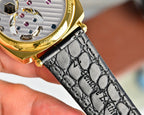 Vacheron Constantin watch with black leather strap and gold caseback details