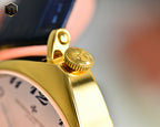 Vacheron Constantin watch with gold crown and black leather strap