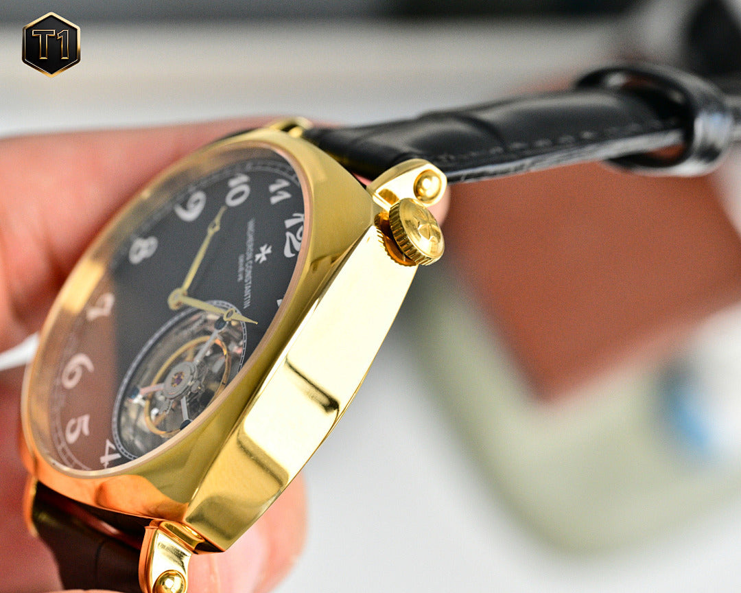 Vacheron Constantin watch with black dial, gold case, and black leather strap