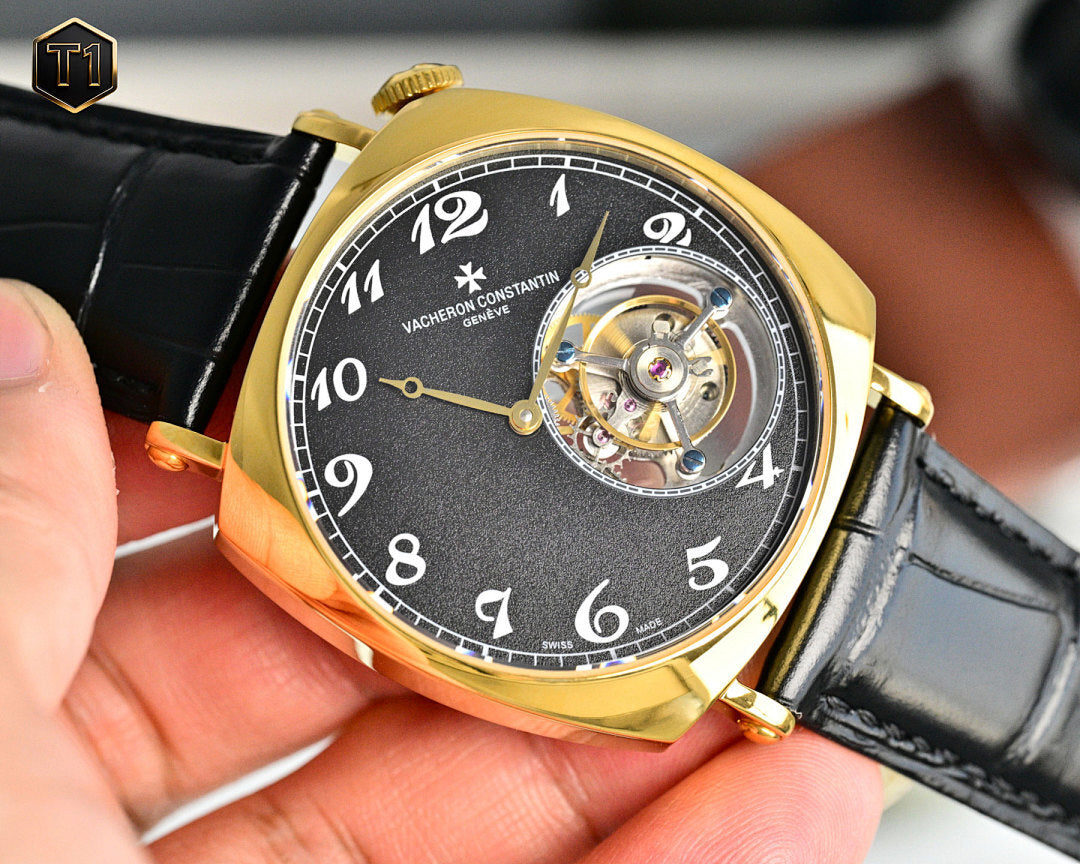Vacheron Constantin watch with black dial, gold case, and black leather strap