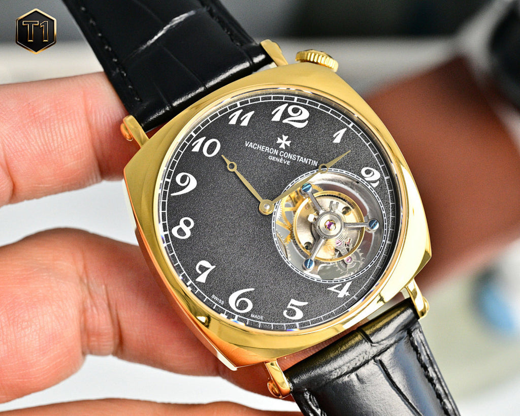 Vacheron Constantin watch with black dial and gold case, black leather strap
