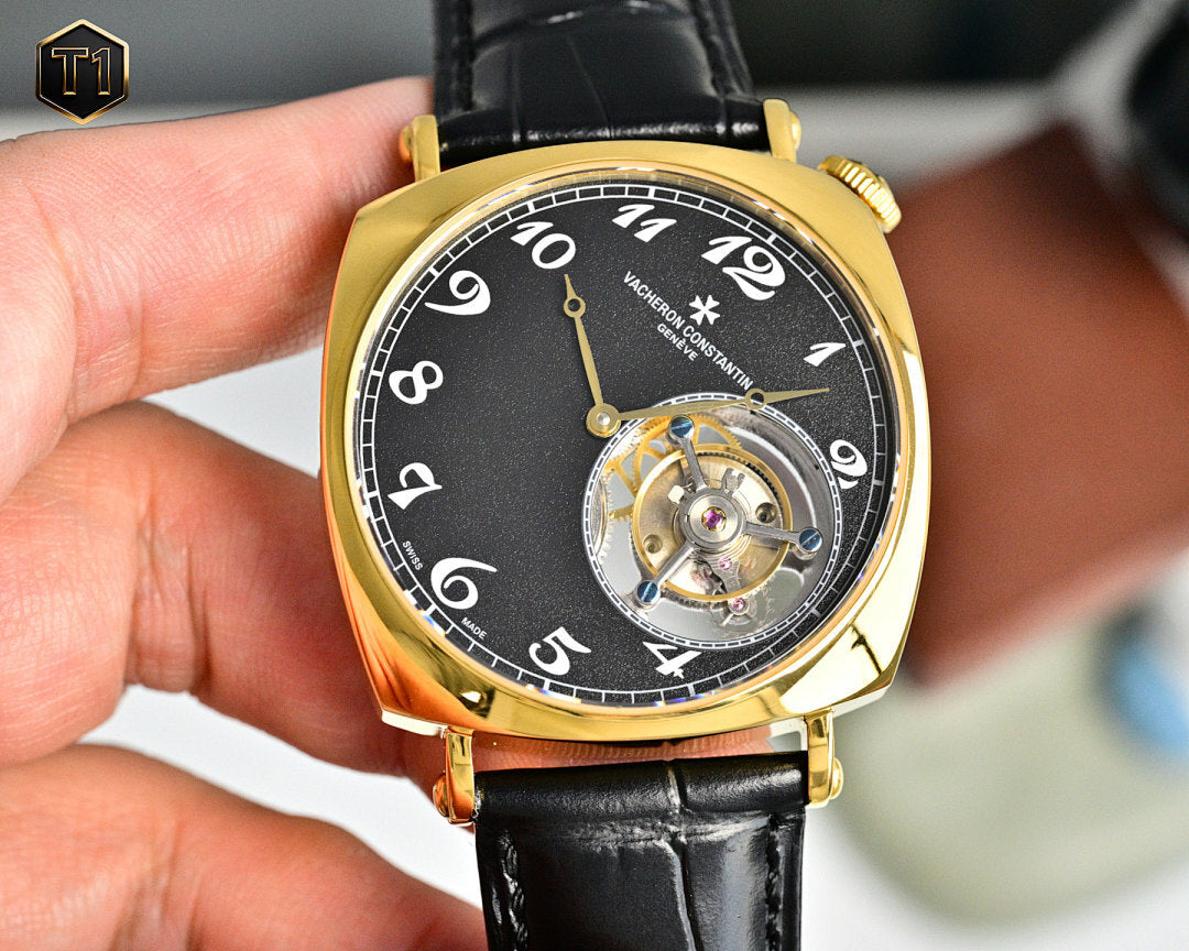 Vacheron Constantin watch with black dial, gold case, and black leather strap