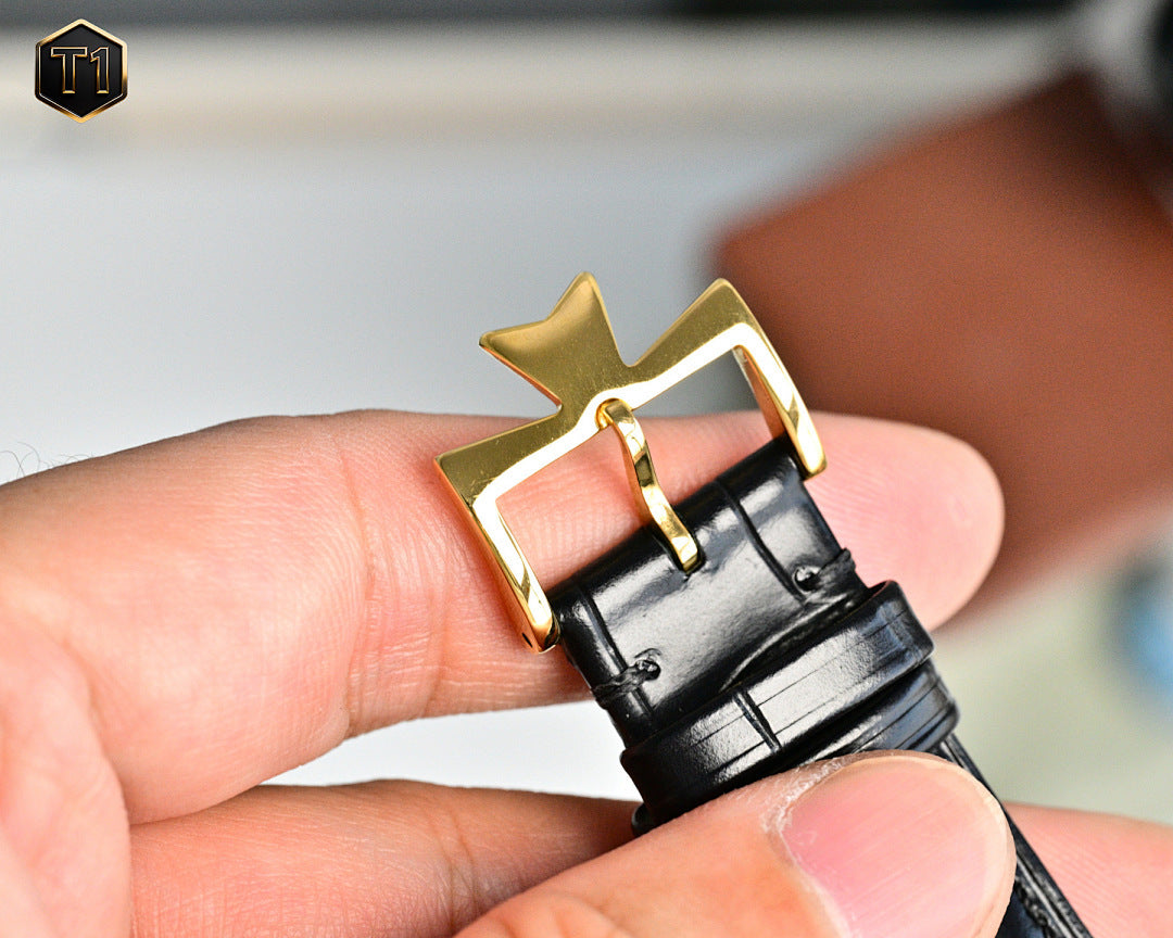 Vacheron Constantin watch with black leather strap and gold buckle clasp