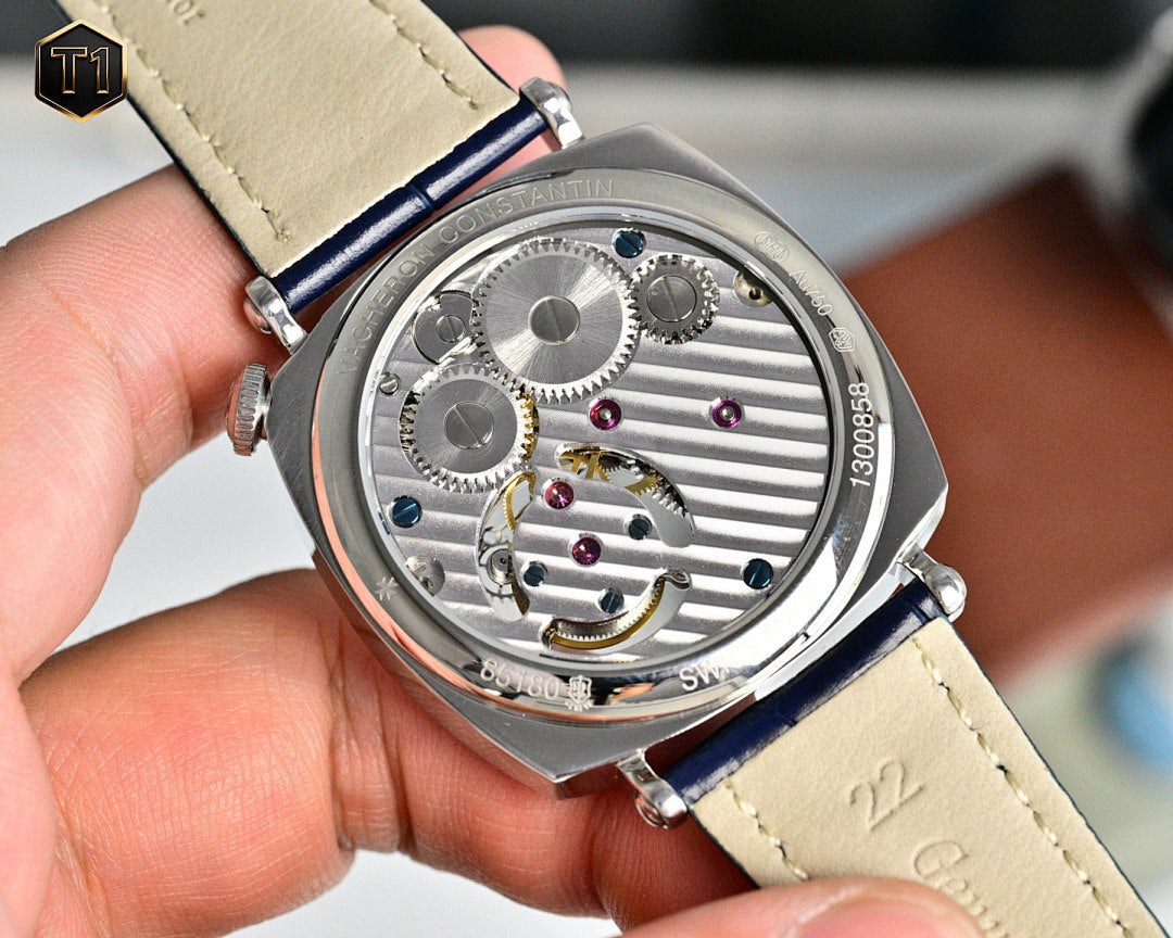 Vacheron Constantin watch case back with visible mechanical movement and blue strap
