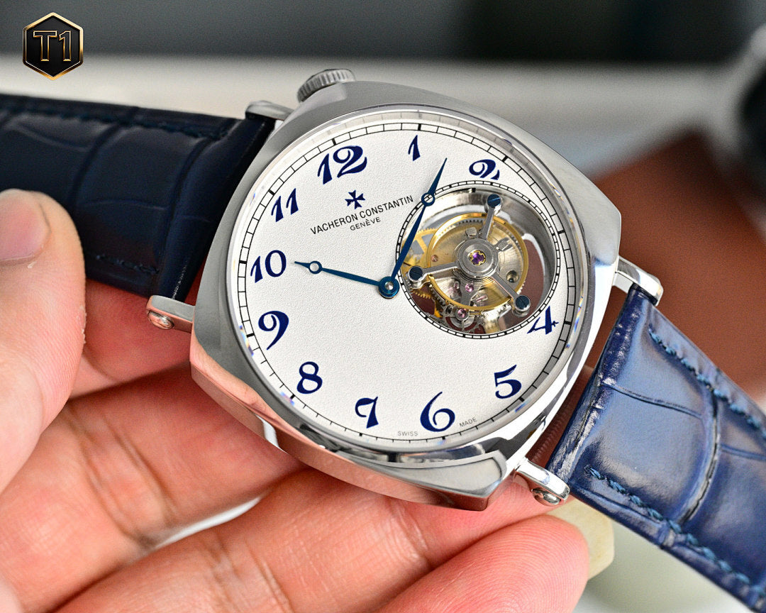Vacheron Constantin watch with blue leather strap and visible gears on white dial
