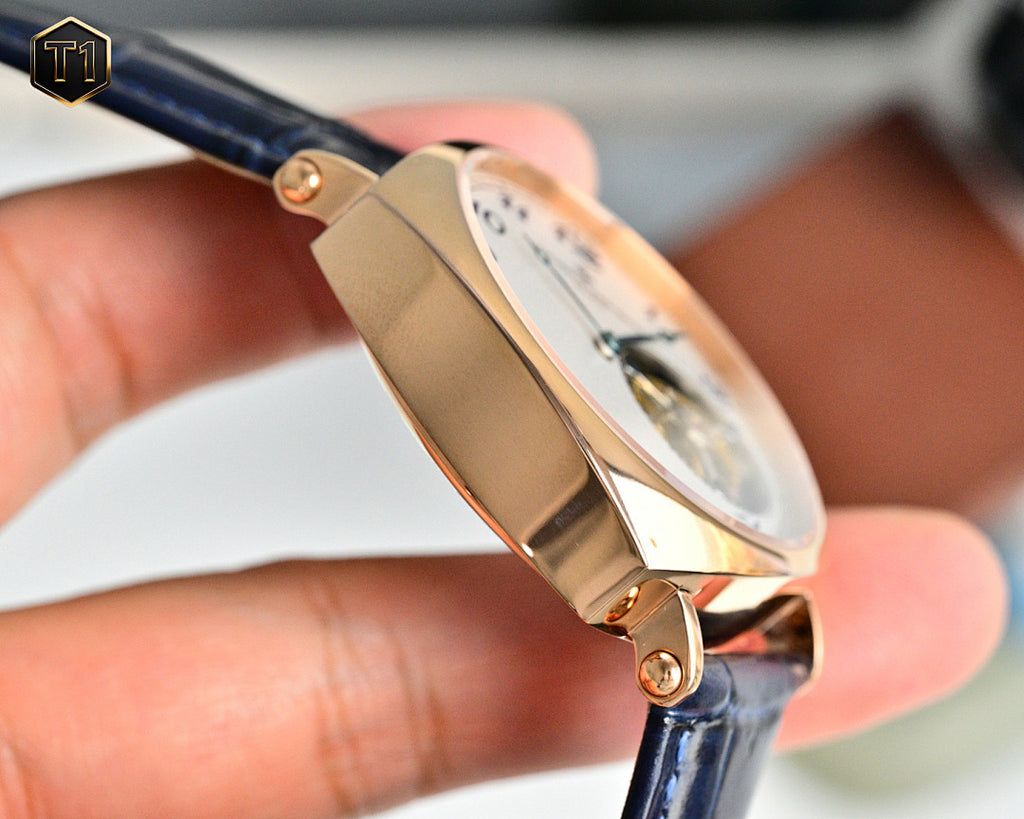 Vacheron Constantin wristwatch side profile with rose gold case and blue leather strap