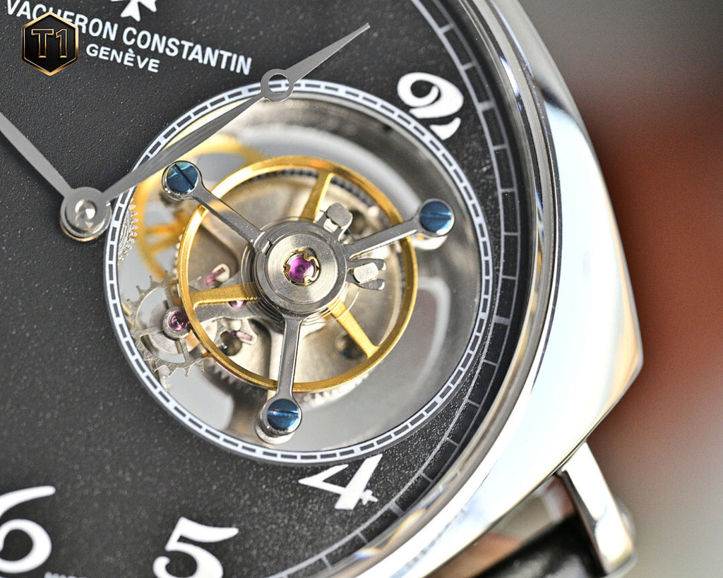 Vacheron Constantin watch movement close-up with gold-toned components on black dial