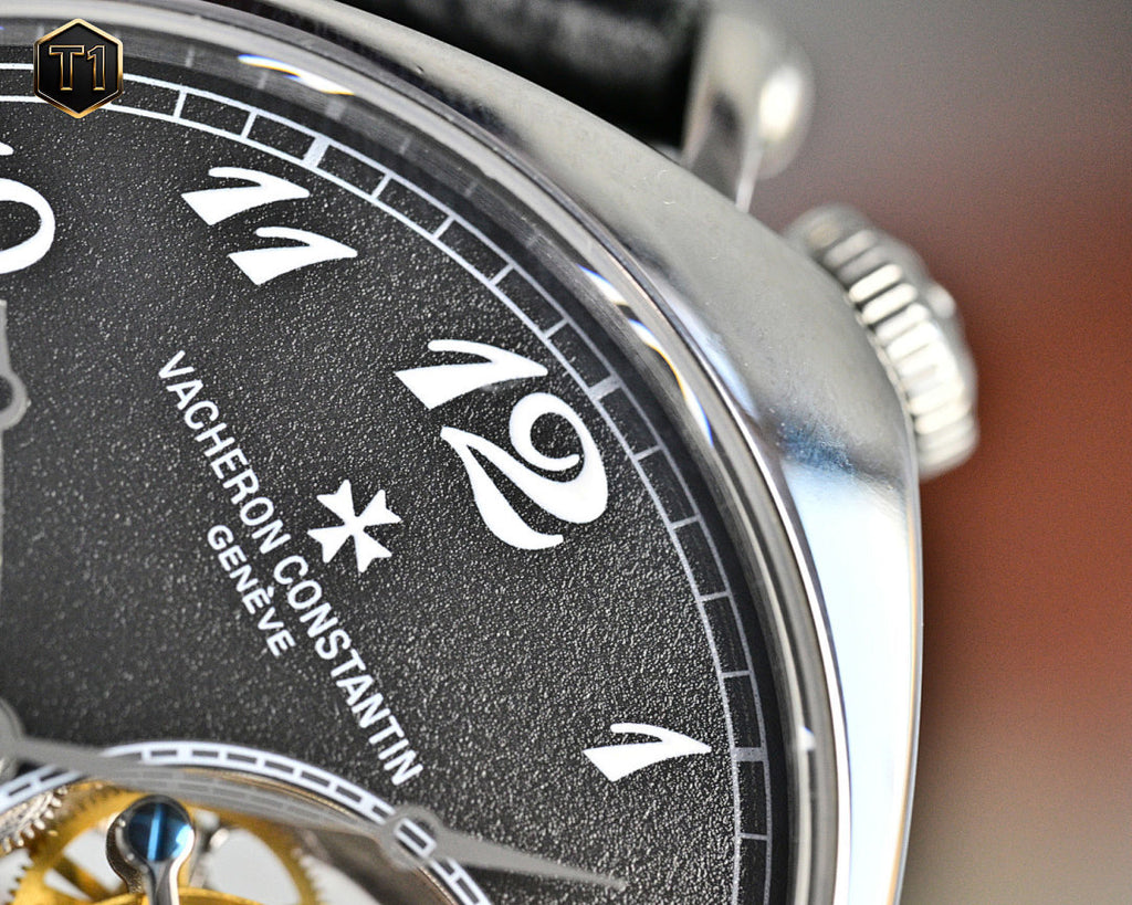 Vacheron Constantin watch bezel with roman numerals on black dial