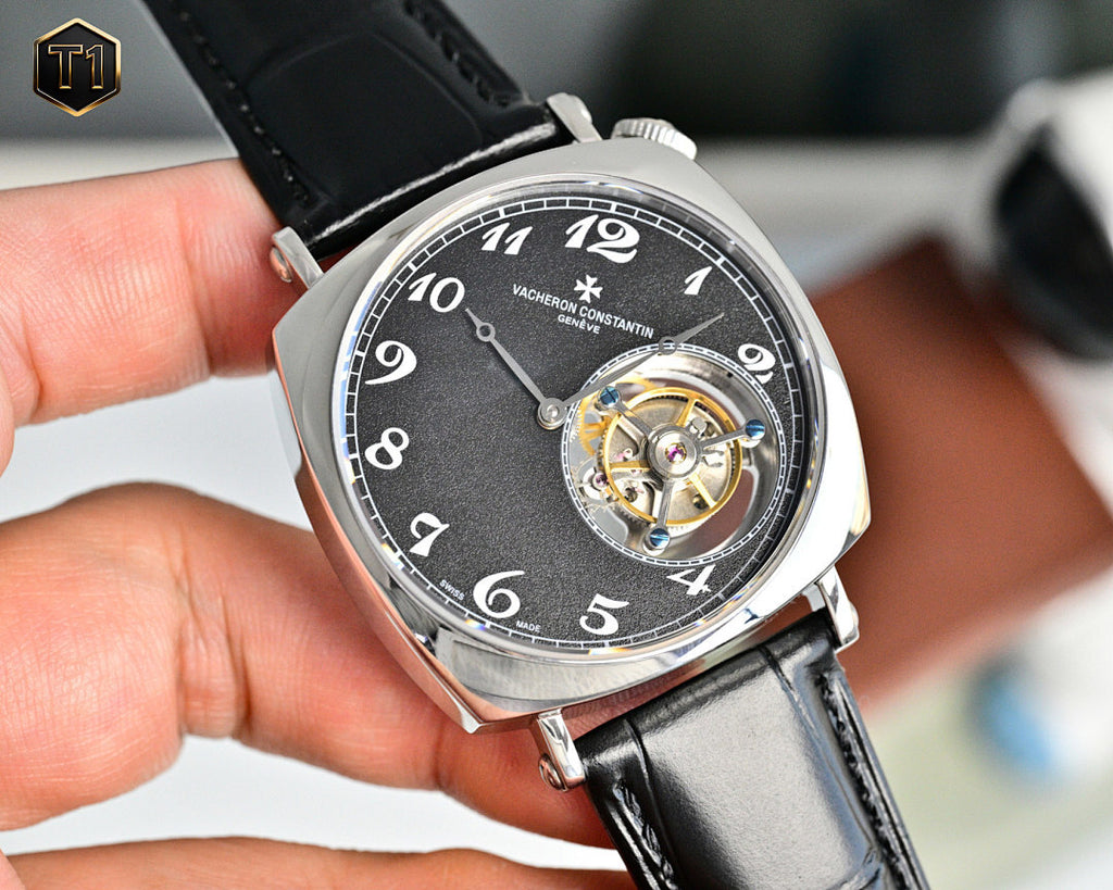 Vacheron Constantin mechanical watch with black dial and visible gold-toned movement