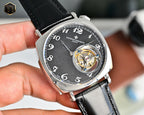 Vacheron Constantin mechanical watch with black dial and visible gold-toned movement