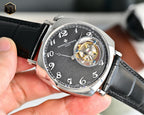 Vacheron Constantin watch with black dial and visible gold-toned balance wheel