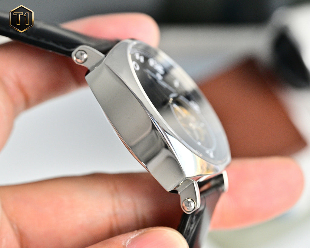 Vacheron Constantin mechanical watch, silver-toned case and crown with black leather strap