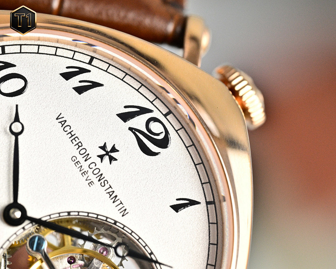 Vacheron Constantin watch close-up: white dial with black numerals and gold case