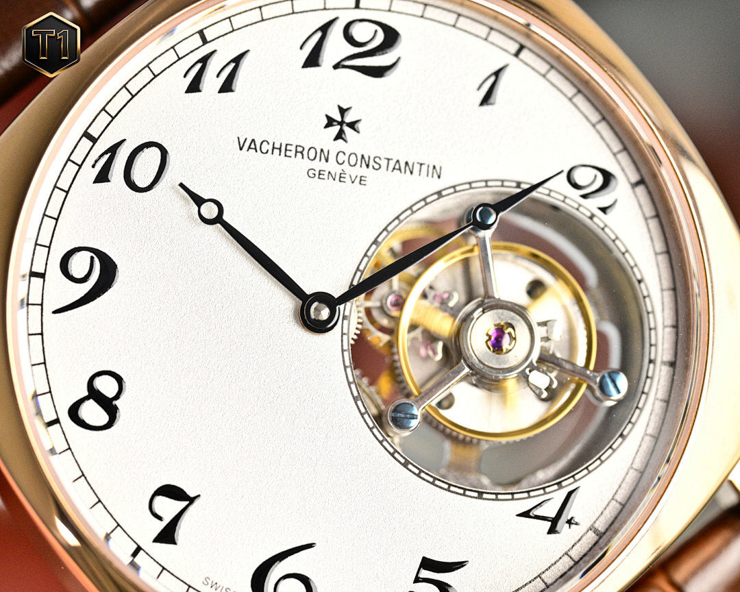 Vacheron Constantin watch macro showing white dial and exposed gold-toned movement