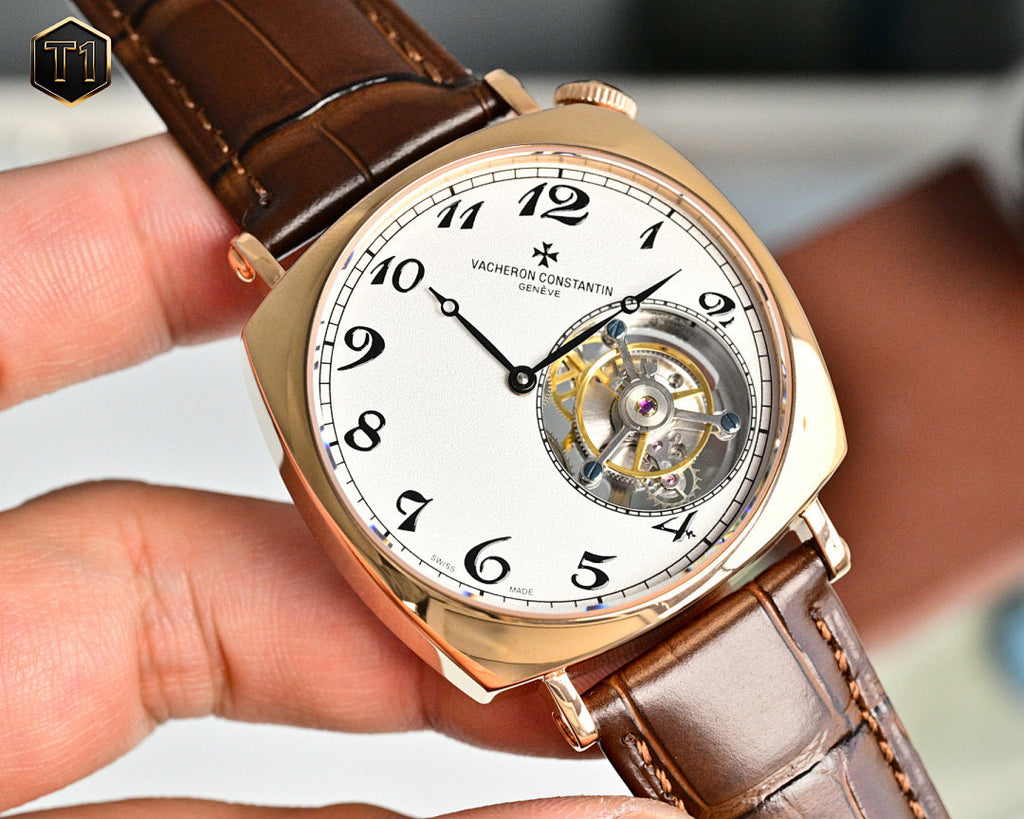 Vacheron Constantin watch angled front view with white dial, gold case, brown leather strap