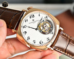 Vacheron Constantin watch three-quarter view with white dial and visible mechanical movement