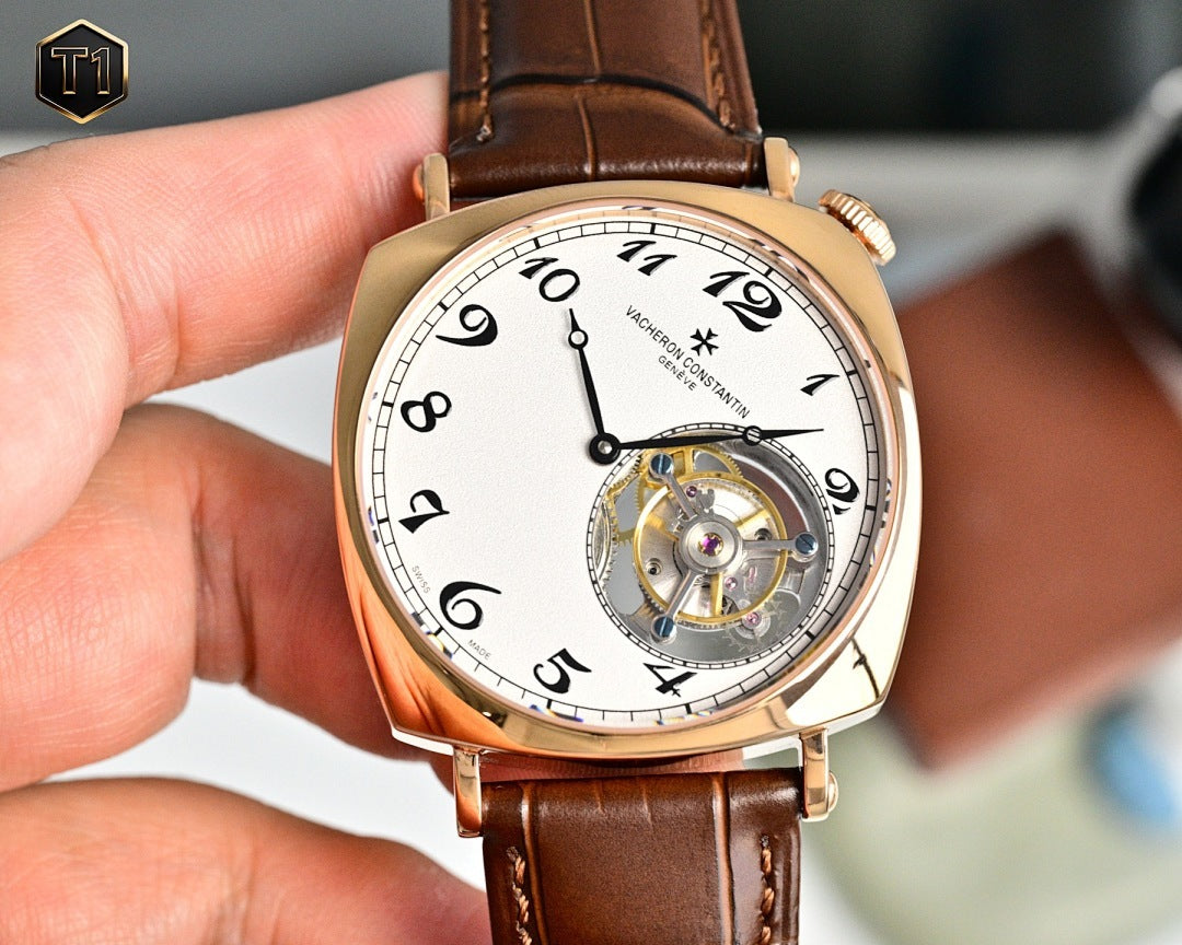 Vacheron Constantin watch with white dial, gold case, brown leather strap, visible movement