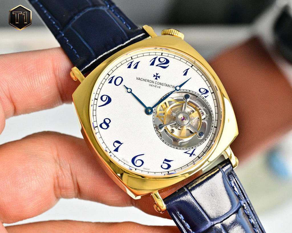 Vacheron Constantin gold-tone wristwatch with blue dial, visible movement, and blue strap