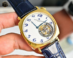 Vacheron Constantin gold-tone wristwatch with blue dial, visible movement, and blue strap