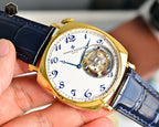 Vacheron Constantin gold bezel watch with blue leather strap and visible movement dial