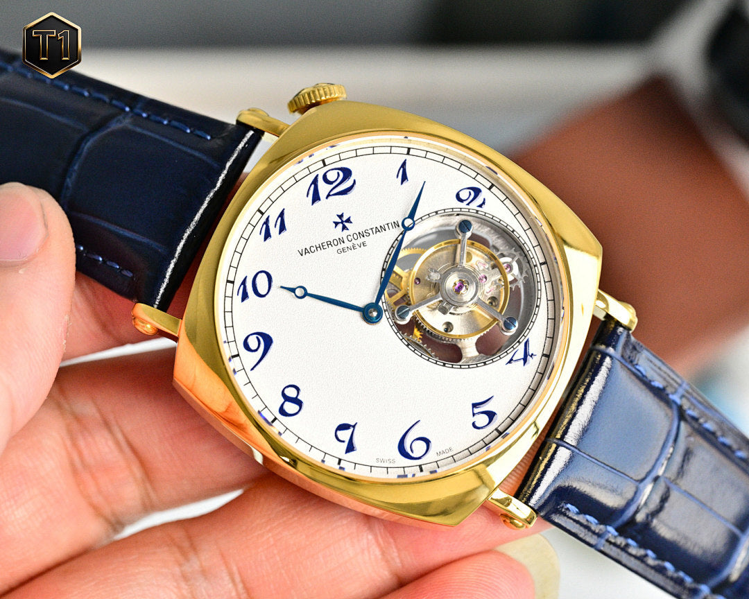 Vacheron Constantin gold bezel watch with blue leather strap and visible movement dial